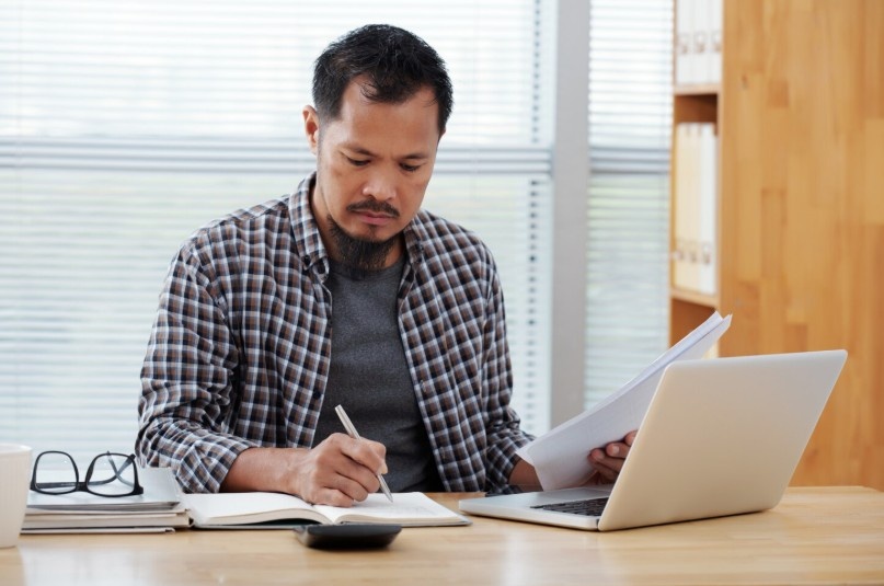 Person reviewing personal finance budget on laptop, Personal Finance for Beginners