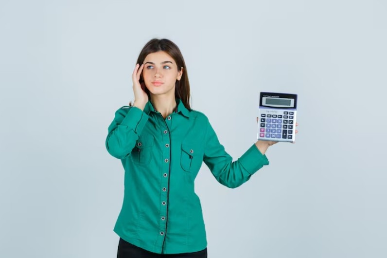 Person calculating debt payoff strategy, Personal Finance for Beginners